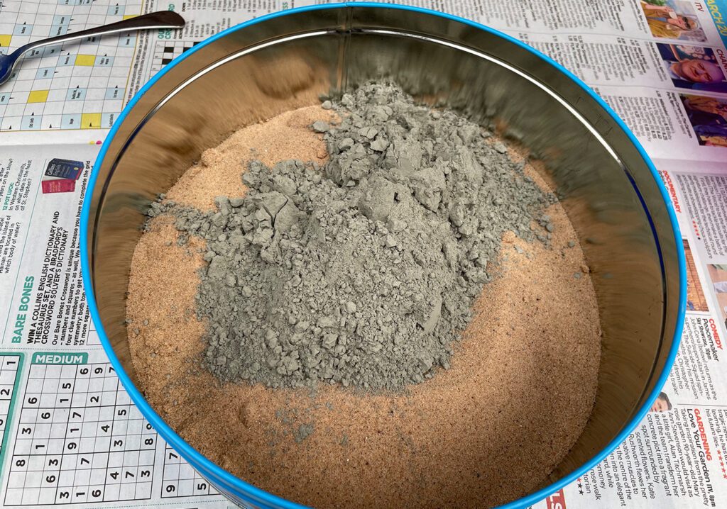 Mix the sand and cement together