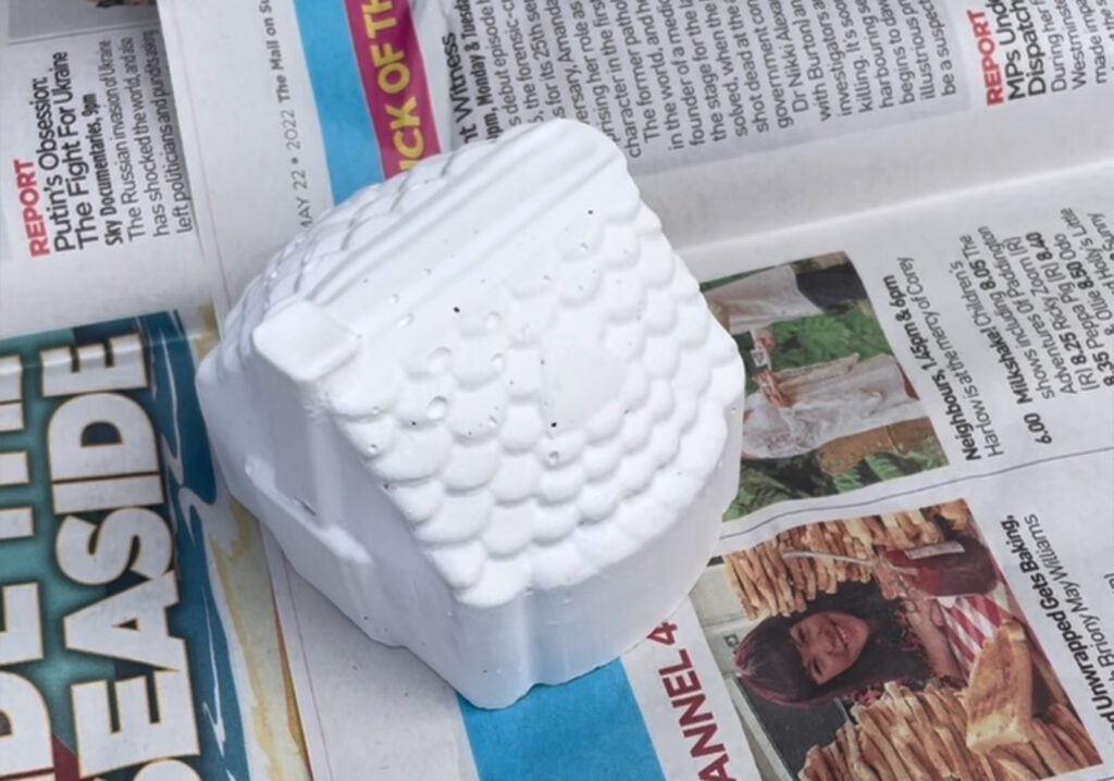 White primer added to mini cement house casting