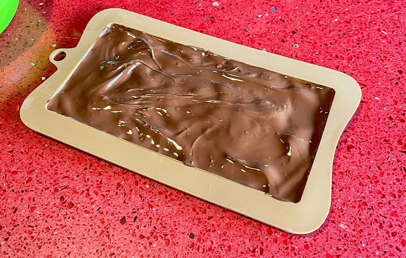 Fill the mould with melted chocolate