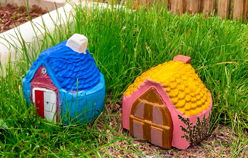 painted mini cement houses - garden ornaments