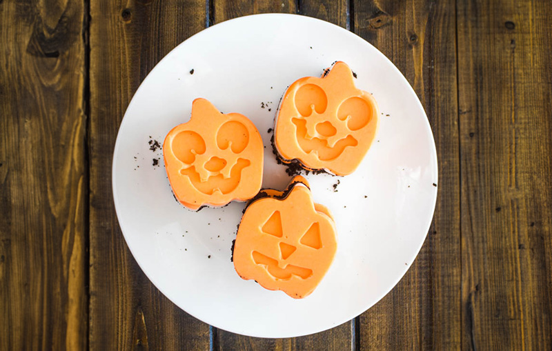 Halloween Themed treats on a plate. Orange pumpkin shaped