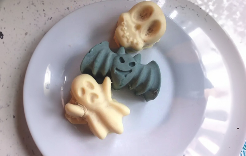 Spooky filled halloween cake bites on a plate