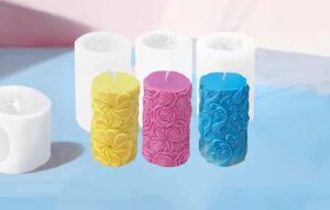 Three unique candle moulds and 3 candles designs in pink, yellow and blue