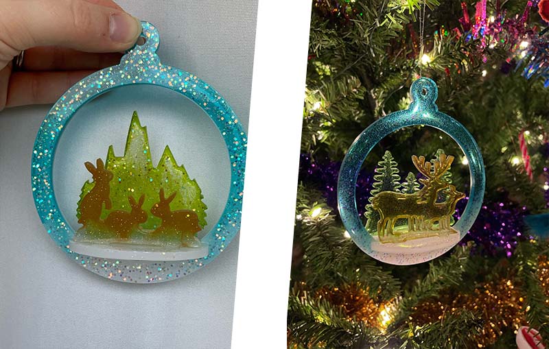 A resin Christmas decoration against a plain background and hanging from a Christmas Tree . making a 3D Resin Christmas Tree decoration
