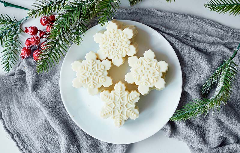 Christmas snowflake cake pops on a plate