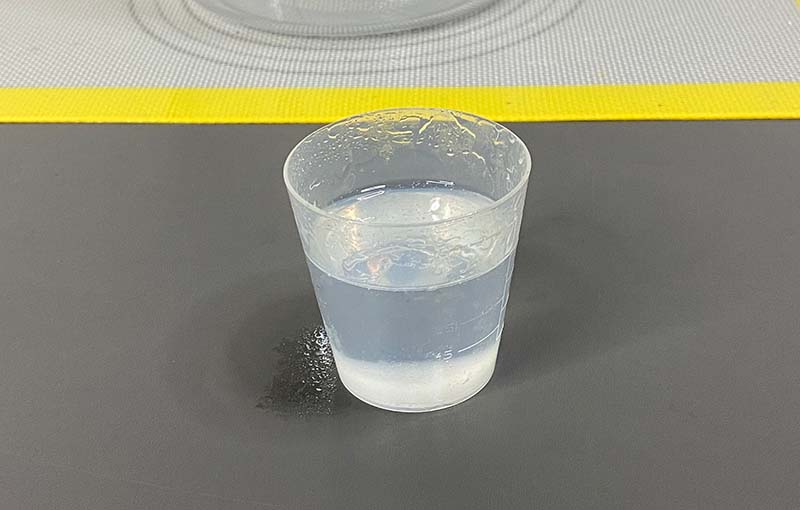 A cup containing bubble free epoxy resin after being treated using the Resiners Airless Lite vacuum
