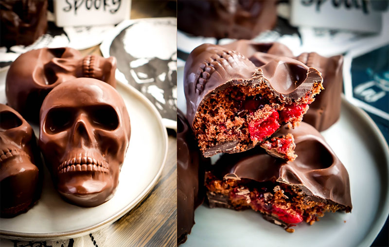 Skull-shaped chocolate cakes with cherry filling, an eerie Halloween baking idea.